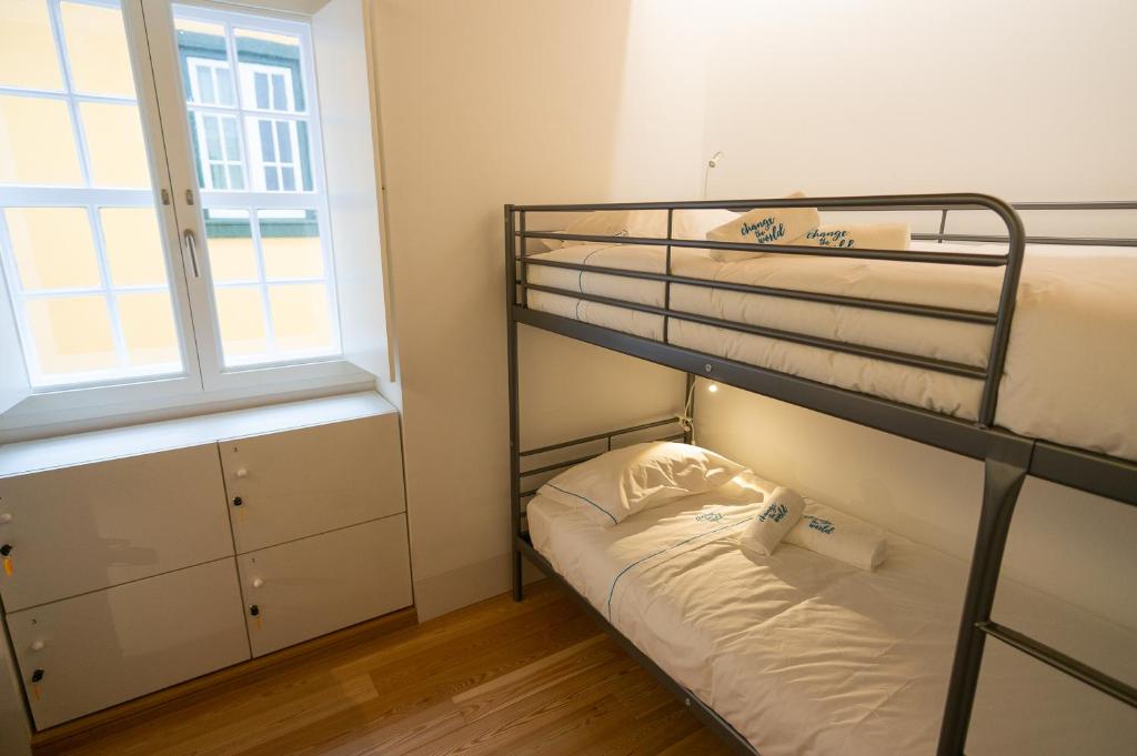Postel nebo postele na pokoji v ubytování Change The World Hostels - Coimbra - Almedina