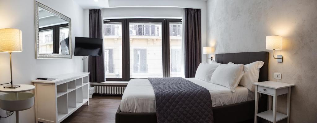 Postel nebo postele na pokoji v ubytování Prestige Rooms Chiaia