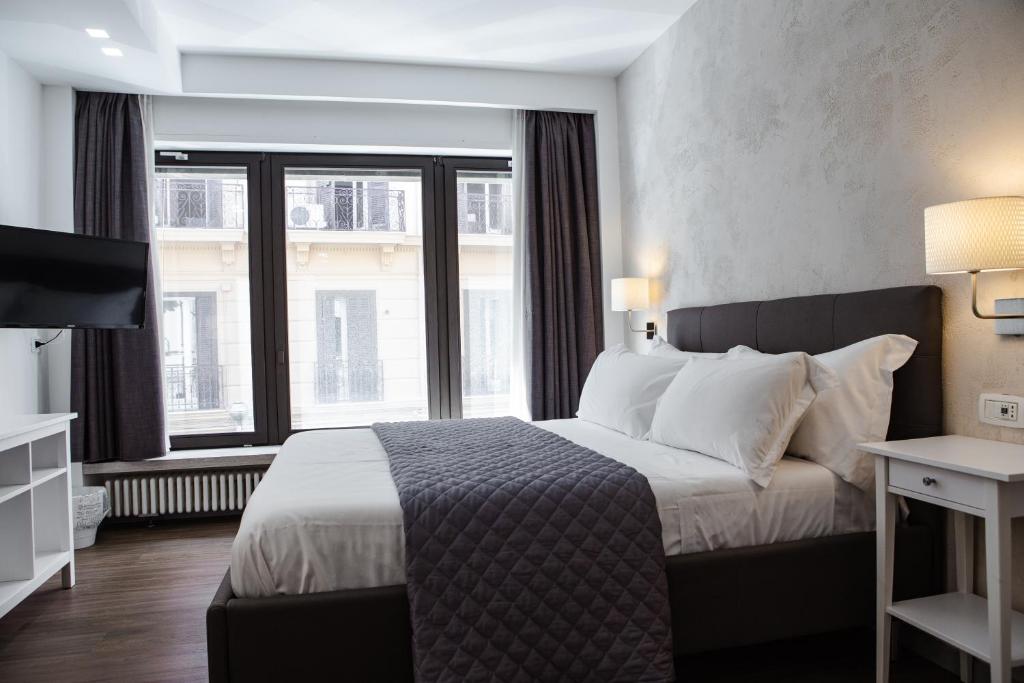 Postel nebo postele na pokoji v ubytování Prestige Rooms Chiaia