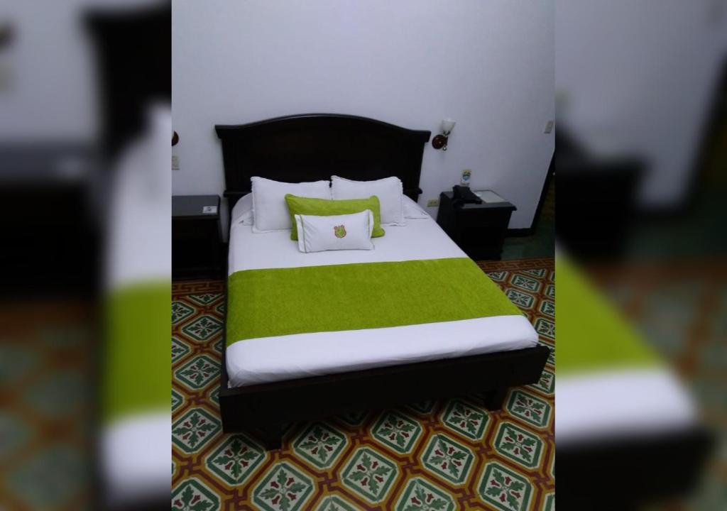 Postel nebo postele na pokoji v ubytování Casa Escobar Buga