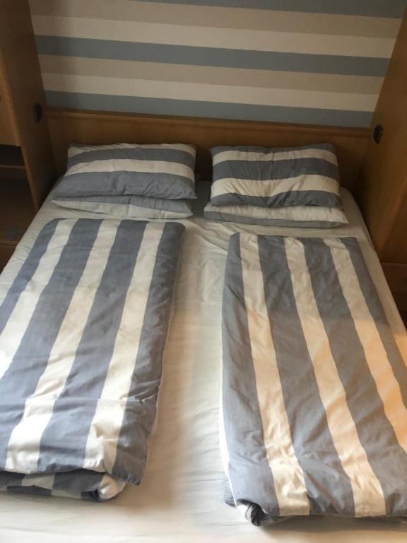 Posteľ alebo postele v izbe v ubytovaní Alpenappartements Domicil include Jokercard
