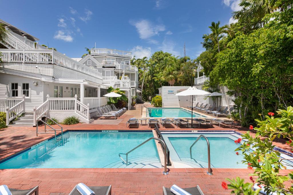 a swimming pool in front of a house at Nyah - Adult Exclusive in Key West