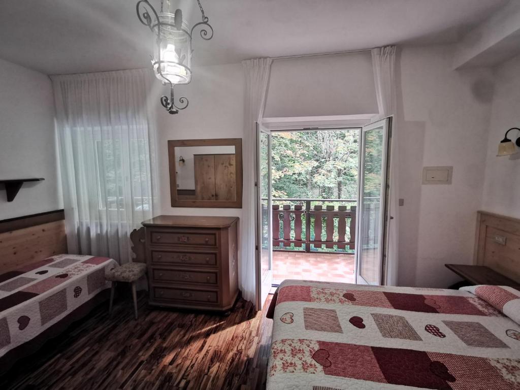 Postel nebo postele na pokoji v ubytování Lago Park Hotel