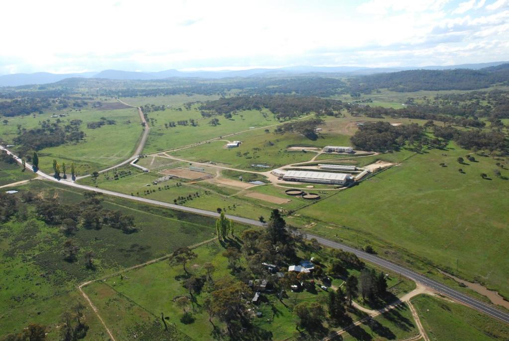 an aerial view of a building in a field at JE Resort in Jindabyne
