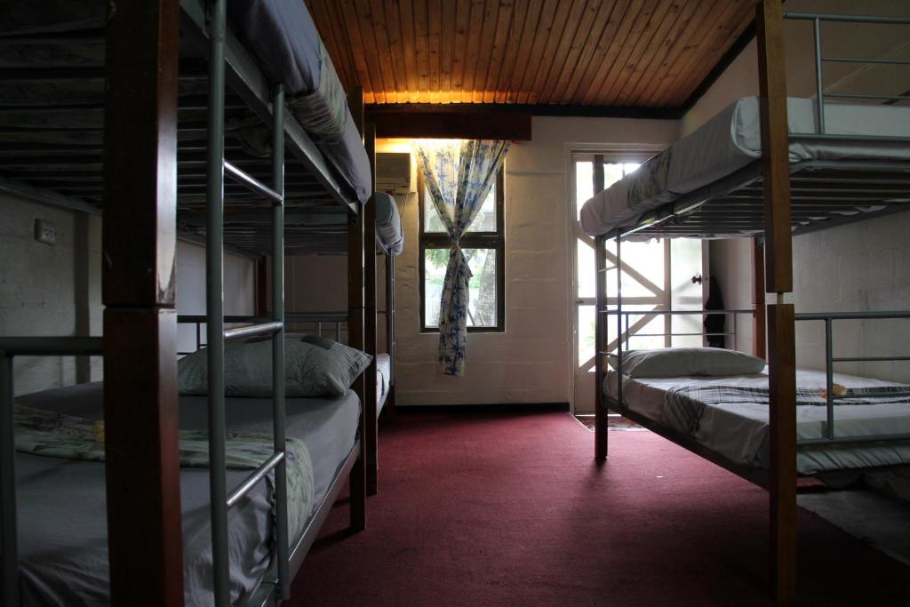 Postel nebo postele na pokoji v ubytování Bamboo Backpackers