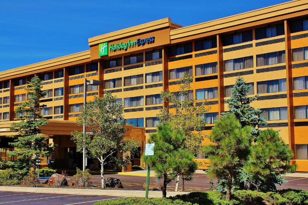 an office building with a sign on the front of it at Holiday Inn Express Flagstaff, an IHG Hotel in Flagstaff