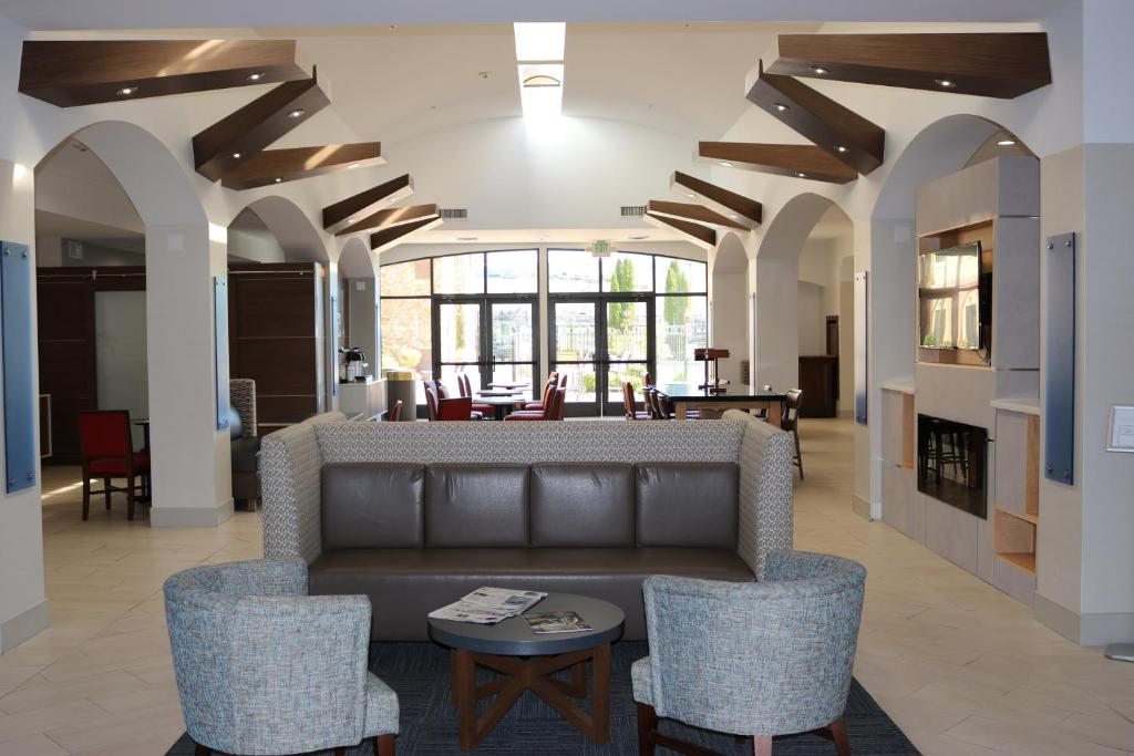 a living room with a couch and chairs at Holiday Inn Express Hotel & Suites El Dorado Hills, an IHG Hotel in El Dorado Hills