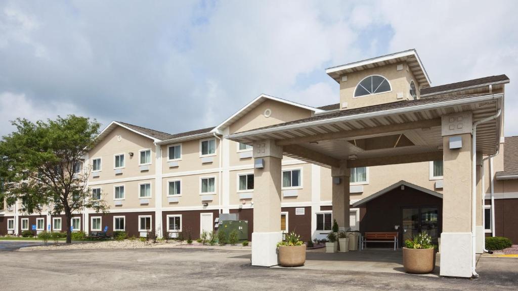 a rendering of a building with a parking lot at Holiday Inn Express Deforest, an IHG Hotel in De Forest