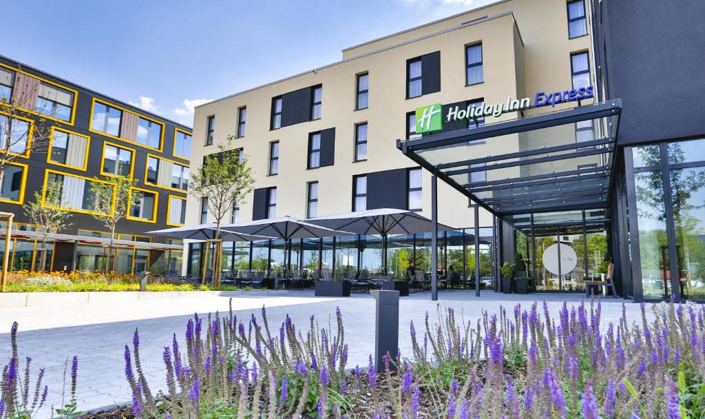 a rendering of the front of a holiday inn express hotel at Holiday Inn Express Karlsruhe - City Park, an IHG Hotel in Karlsruhe