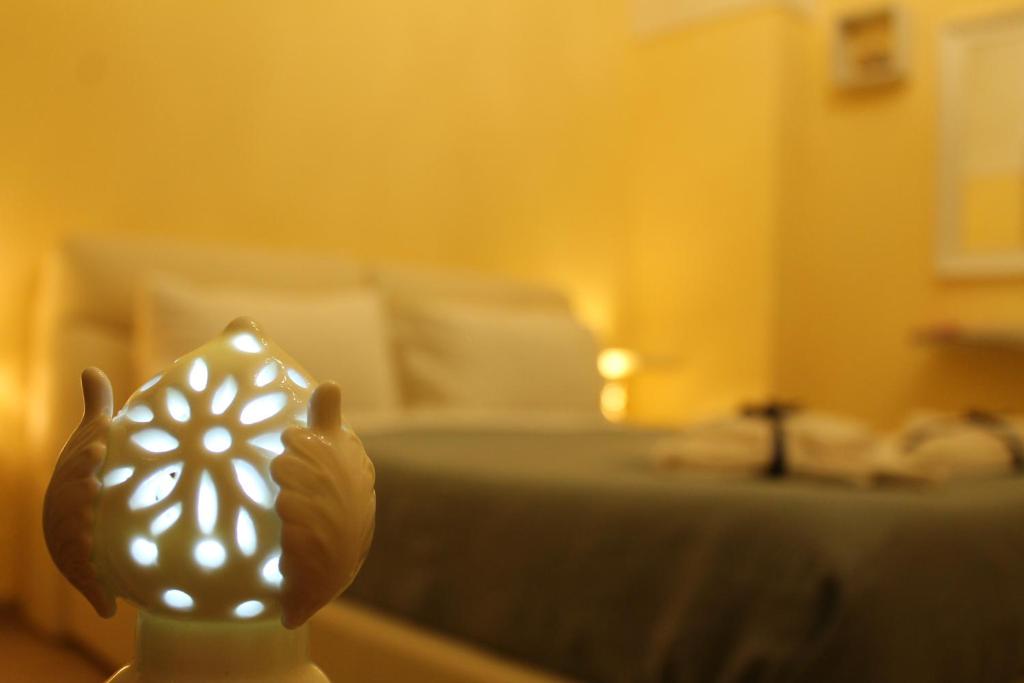 A bed or beds in a room at Arco Suite