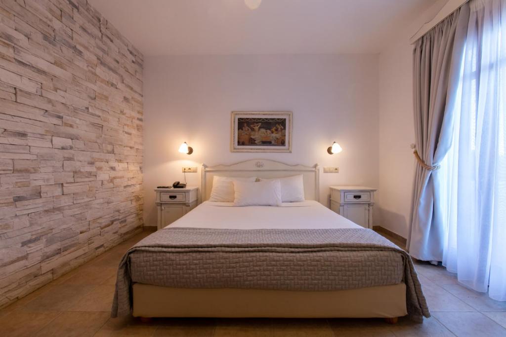 Postel nebo postele na pokoji v ubytování Plaza Beach Hotel