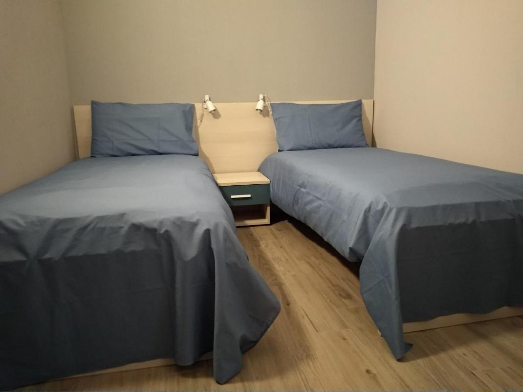 Postel nebo postele na pokoji v ubytování CASCINA PONTETTO