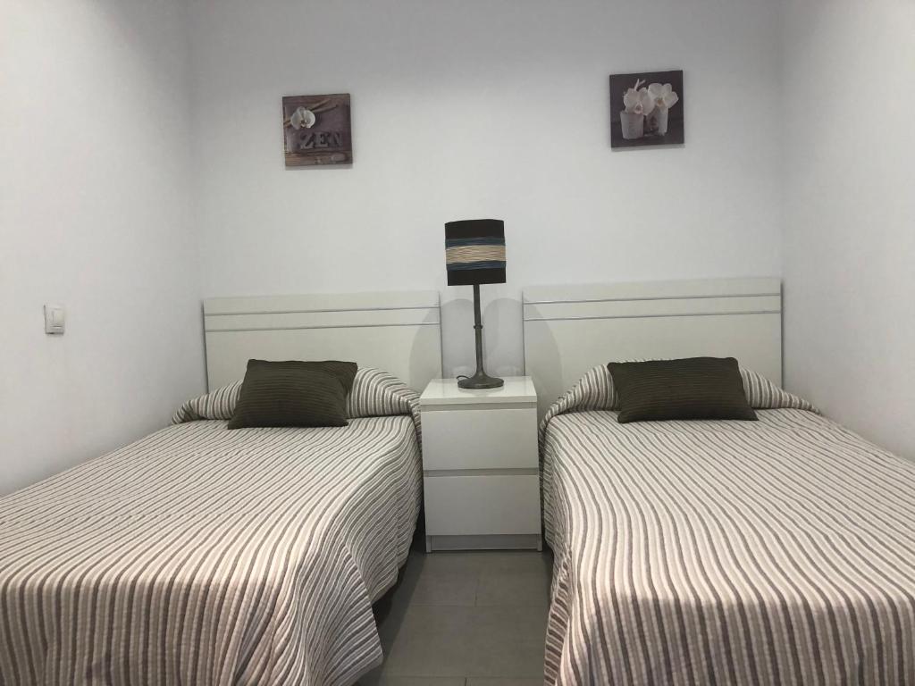 Postel nebo postele na pokoji v ubytování Sweet Apartment Las Canteras