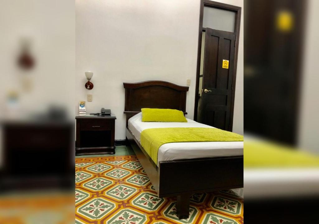 Postel nebo postele na pokoji v ubytování Casa Escobar Buga
