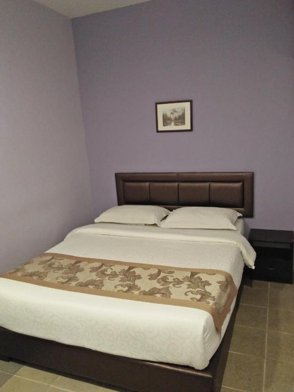 Postel nebo postele na pokoji v ubytování TIONG HUA HOTEL