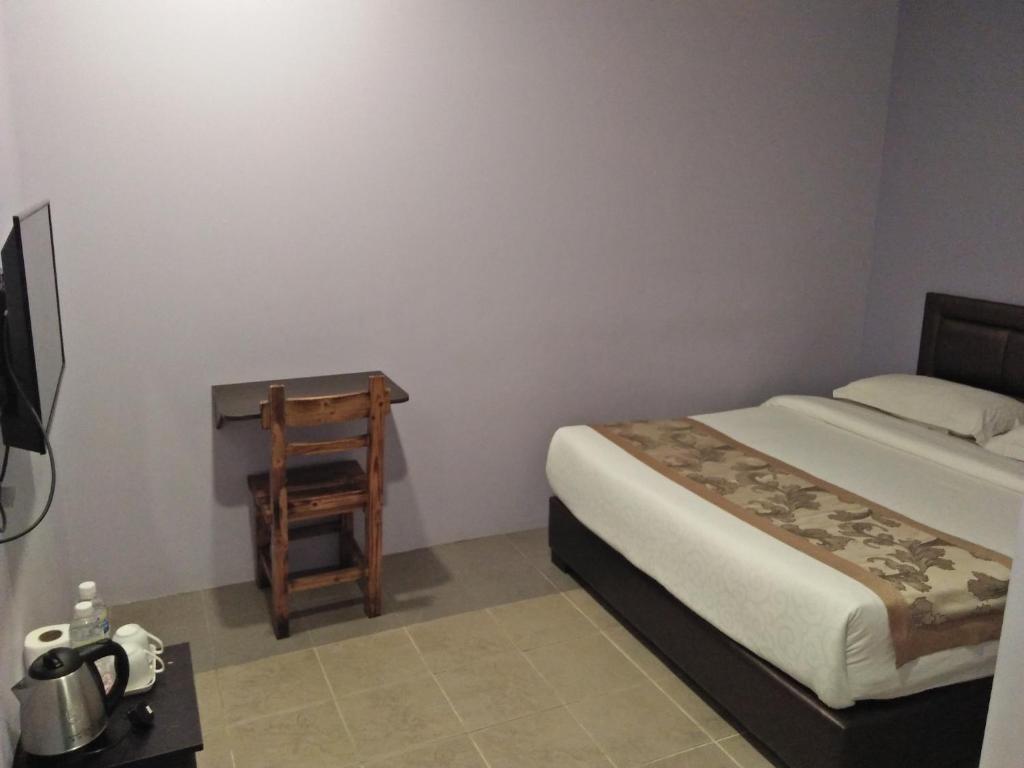 Postel nebo postele na pokoji v ubytování TIONG HUA HOTEL