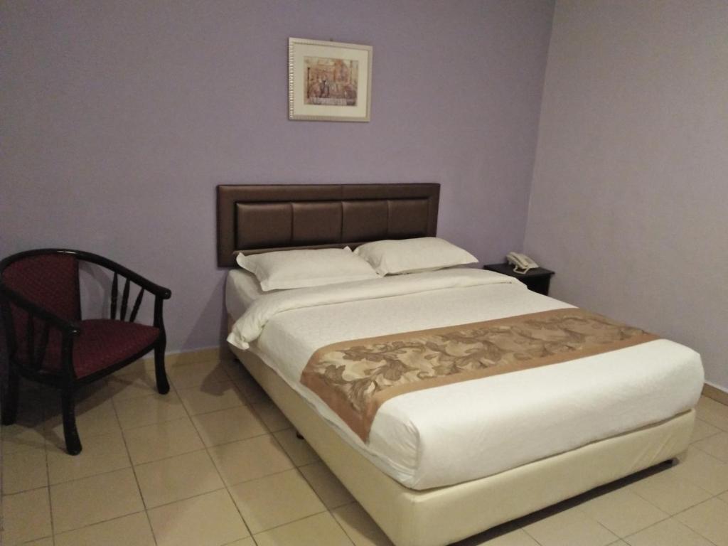 Postel nebo postele na pokoji v ubytování TIONG HUA HOTEL