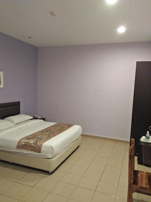 Postel nebo postele na pokoji v ubytování TIONG HUA HOTEL