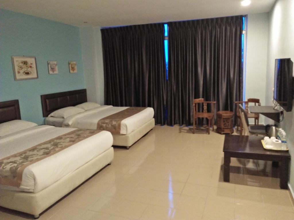 Postel nebo postele na pokoji v ubytování TIONG HUA HOTEL