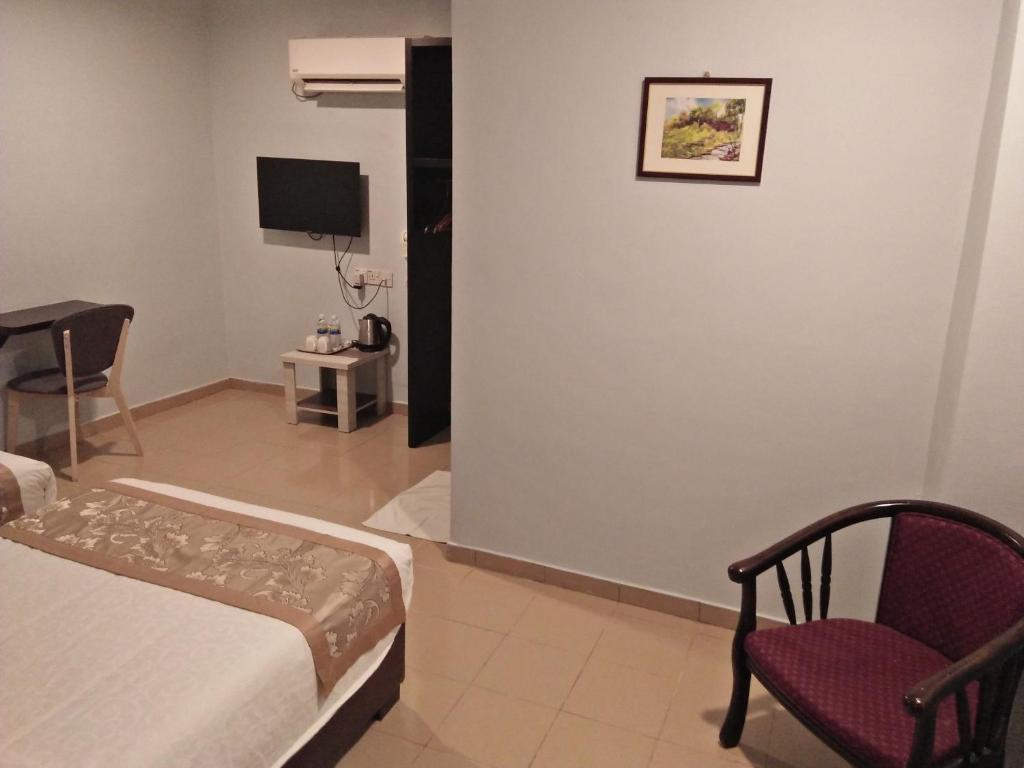 TV a/nebo společenská místnost v ubytování TIONG HUA HOTEL