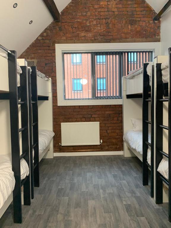 Postel nebo postele na pokoji v ubytování Rahman Hostel