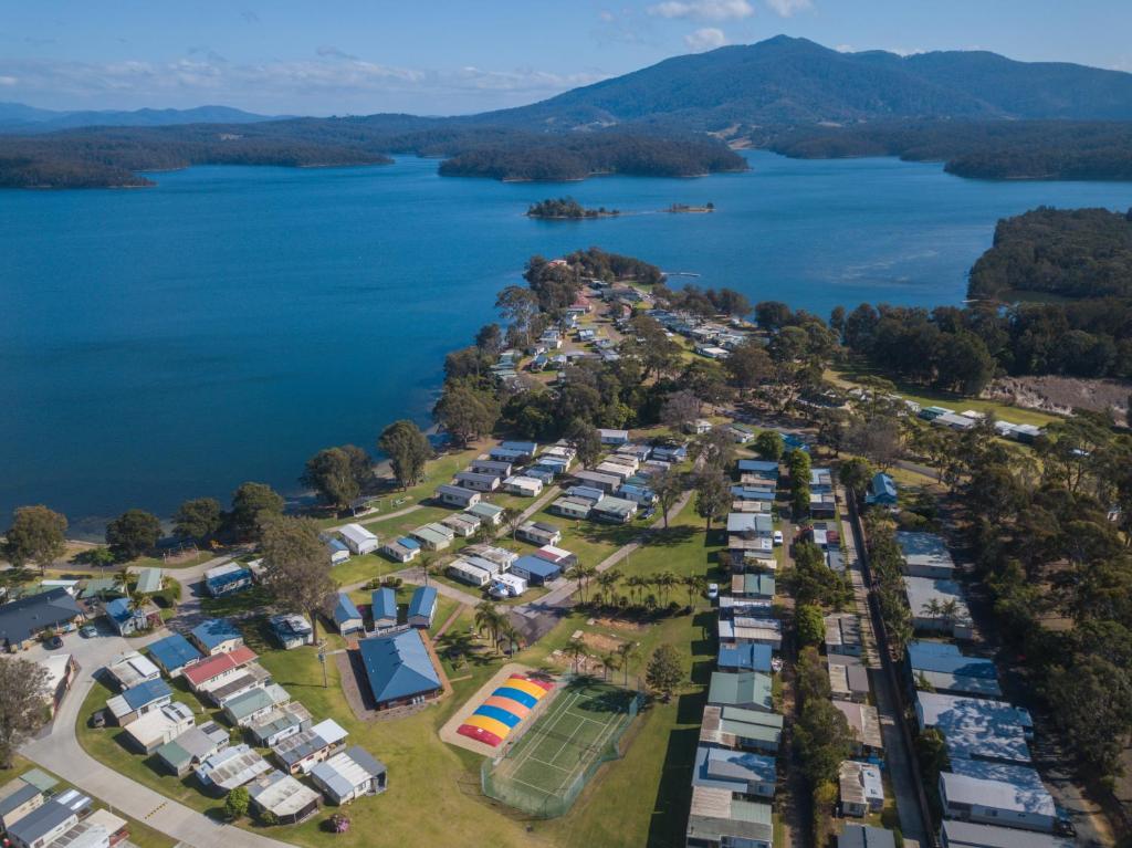 a large body of water with houses and boats at Ingenia Holidays Ocean Lake in Bermagui