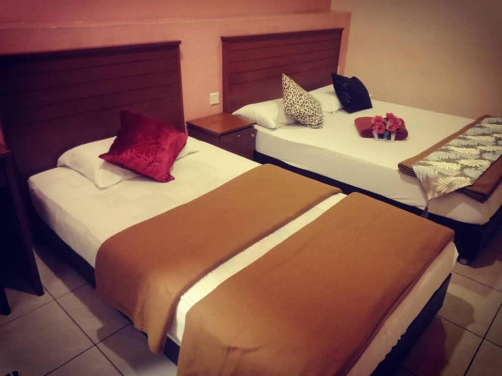 Postel nebo postele na pokoji v ubytování Weng Kong Homestay