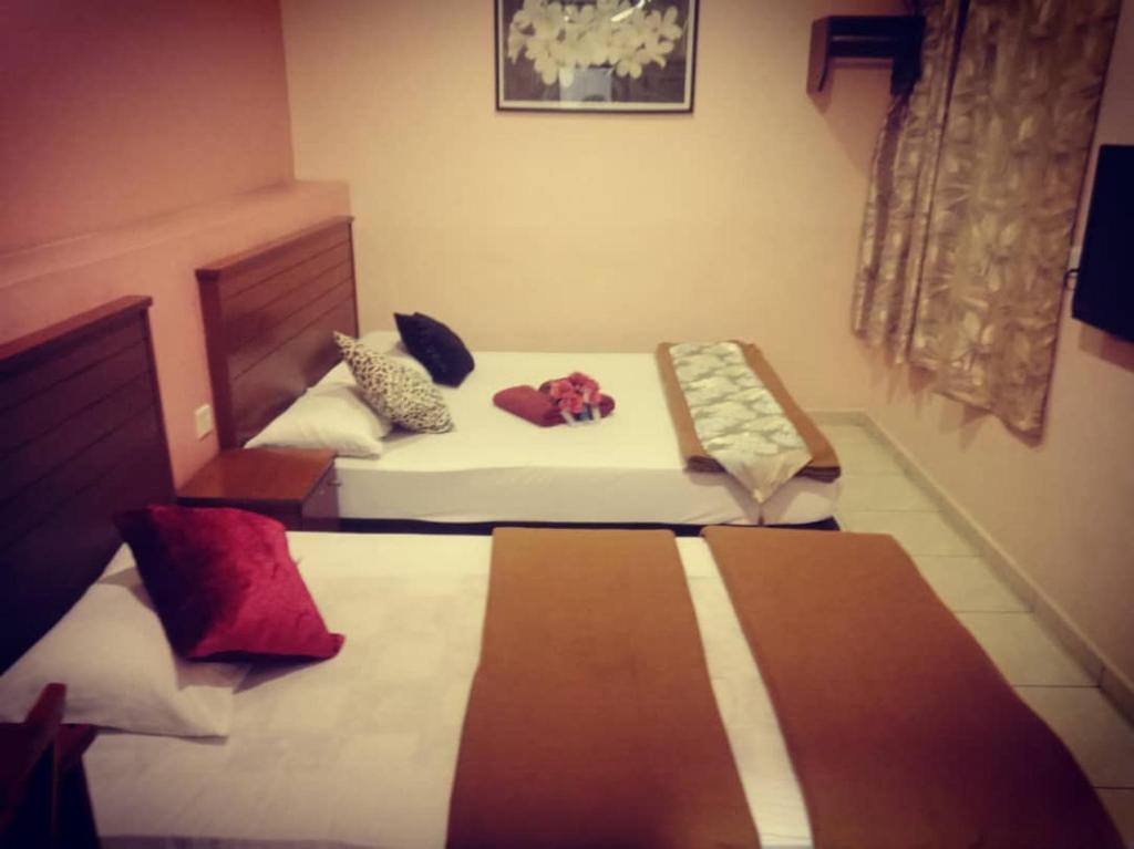 Postel nebo postele na pokoji v ubytování Weng Kong Homestay