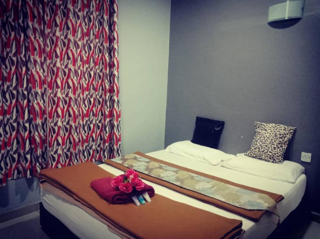 Postel nebo postele na pokoji v ubytování Weng Kong Homestay