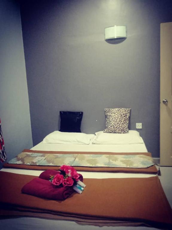 Postel nebo postele na pokoji v ubytování Weng Kong Homestay