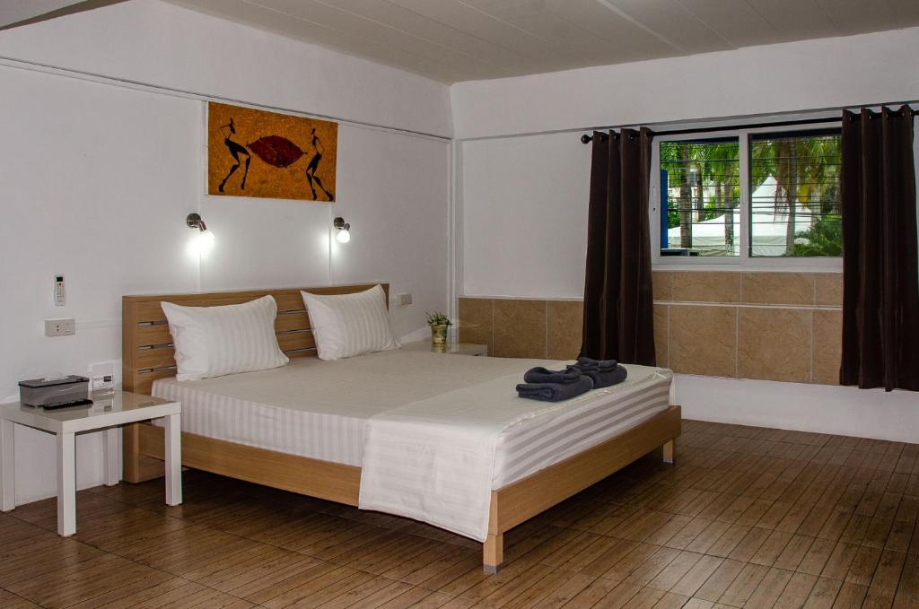 Postel nebo postele na pokoji v ubytování Allstar Guesthouse