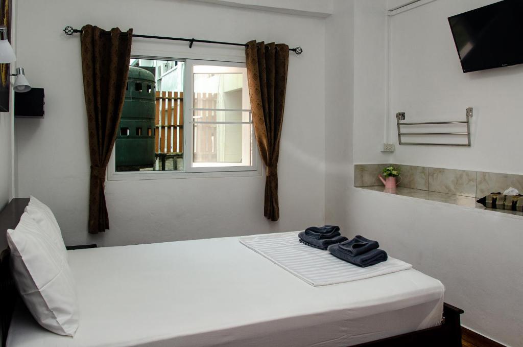 Postel nebo postele na pokoji v ubytování Allstar Guesthouse
