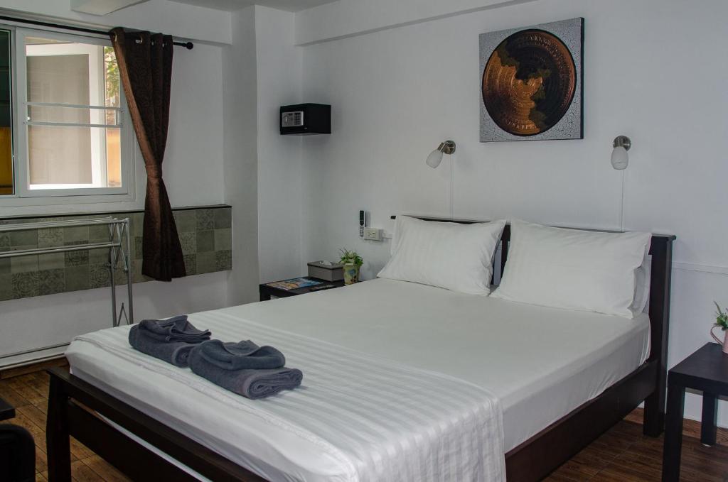 Postel nebo postele na pokoji v ubytování Allstar Guesthouse