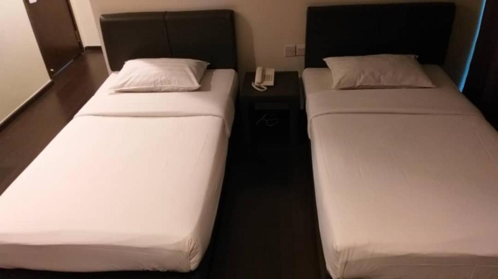 Postel nebo postele na pokoji v ubytování Manja Hotel