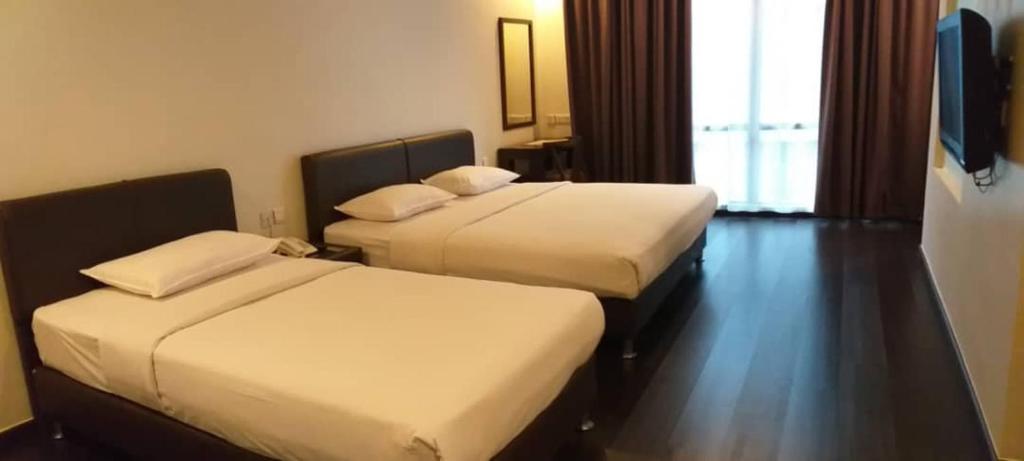 Postel nebo postele na pokoji v ubytování Manja Hotel
