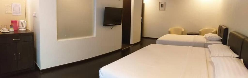 Postel nebo postele na pokoji v ubytování Manja Hotel