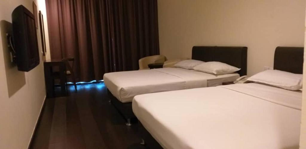 Postel nebo postele na pokoji v ubytování Manja Hotel