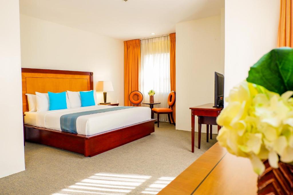 Postel nebo postele na pokoji v ubytování Citi Park Hotel Cebu powered by Cocotel