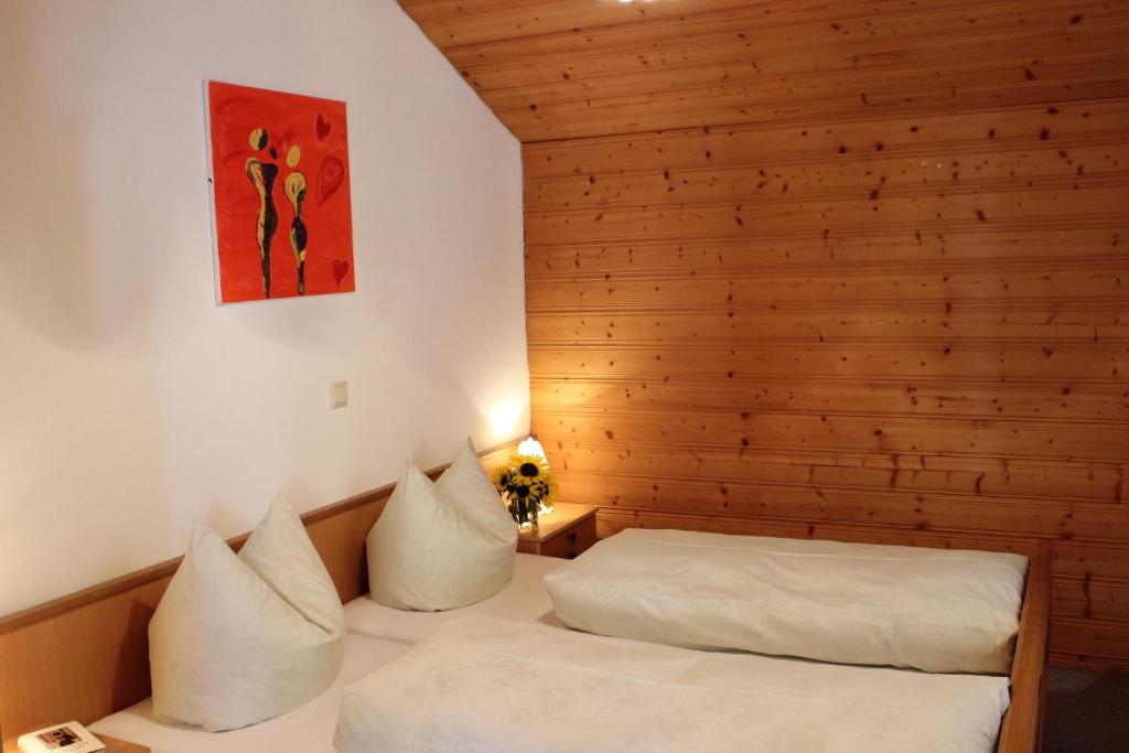 Postel nebo postele na pokoji v ubytování Haus Simma