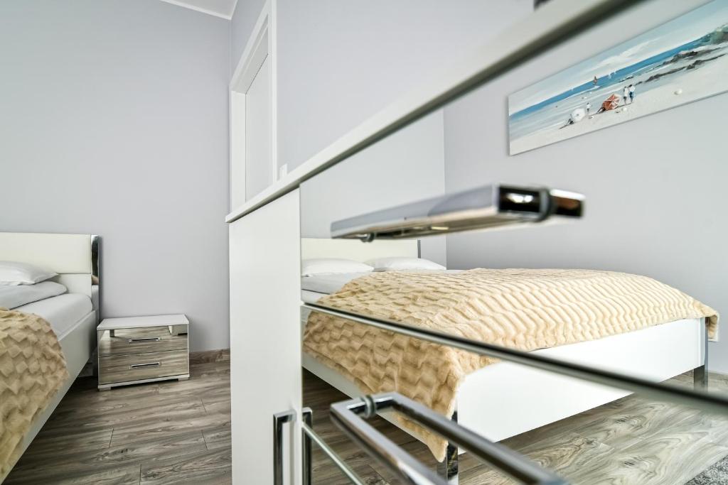 Posteľ alebo postele v izbe v ubytovaní Małe Orłowo LTC - Apartments