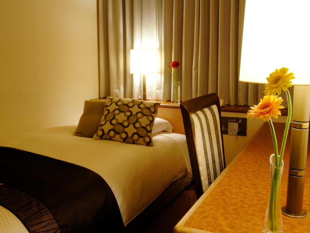 Postel nebo postele na pokoji v ubytování Central Hotel