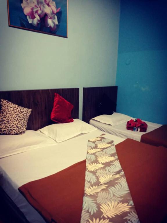 Postel nebo postele na pokoji v ubytování Weng Kong Homestay