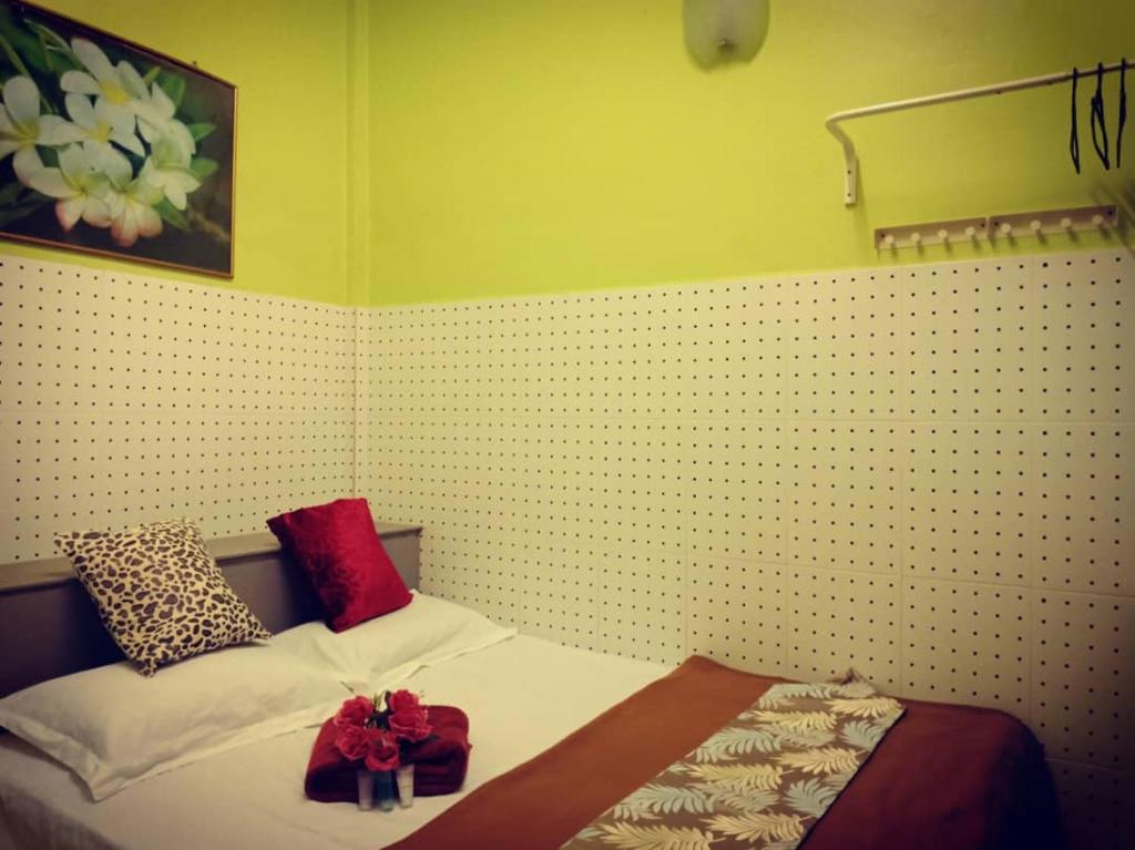 Postel nebo postele na pokoji v ubytování Weng Kong Homestay