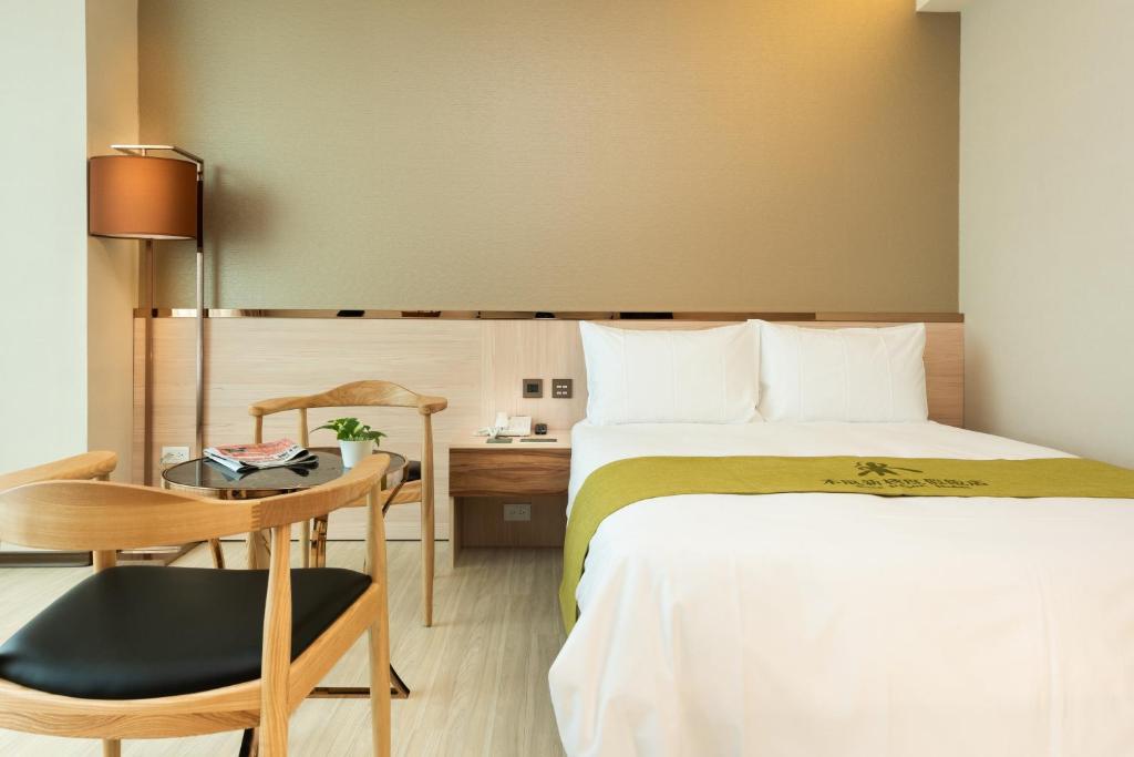 Postel nebo postele na pokoji v ubytování Rice Resort Hotel