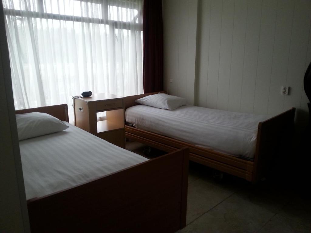 Hotel Den Helderにあるベッド