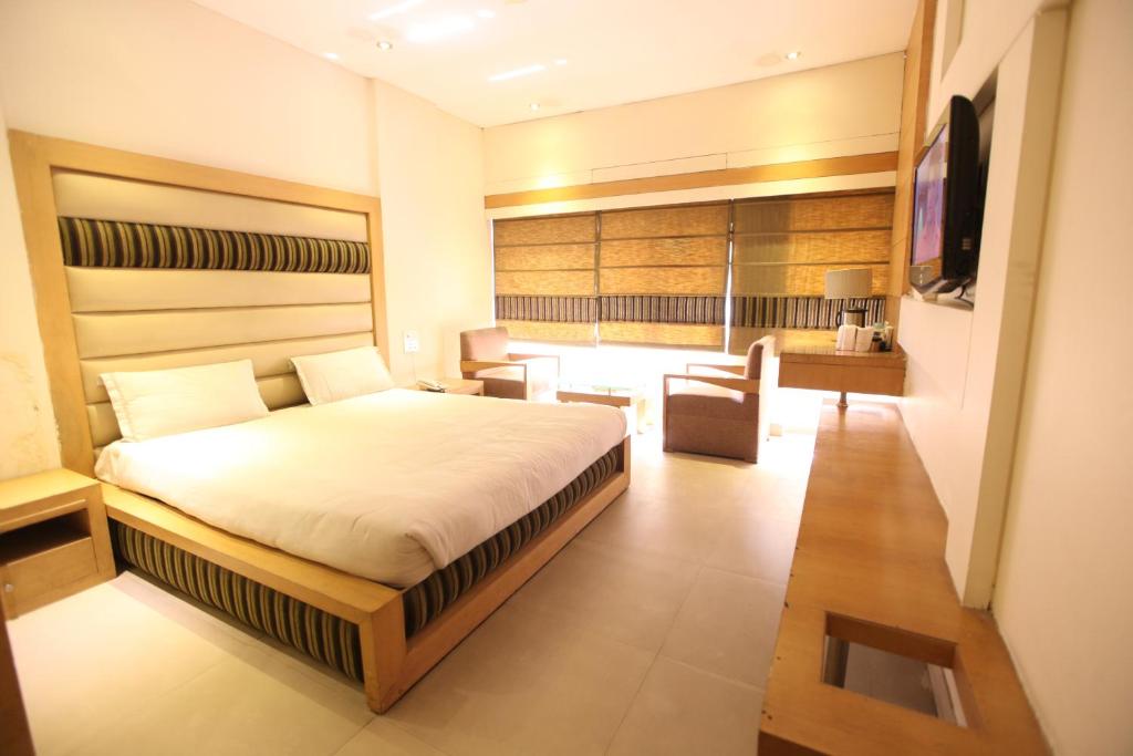 Кровать или кровати в номере Hotel Landmark