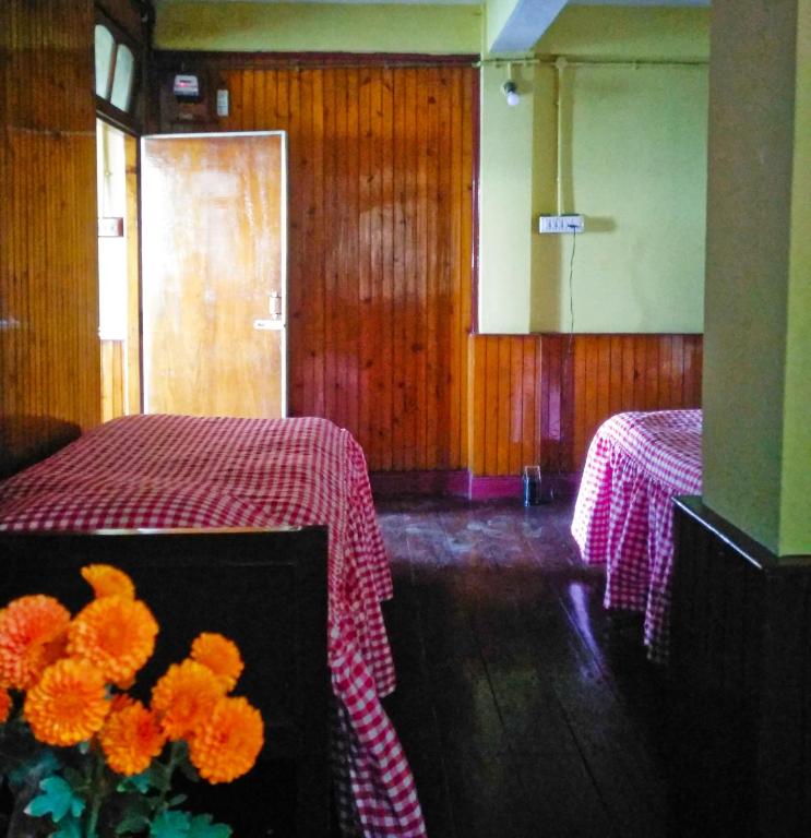 Postel nebo postele na pokoji v ubytování West Point Backpackers Hostel