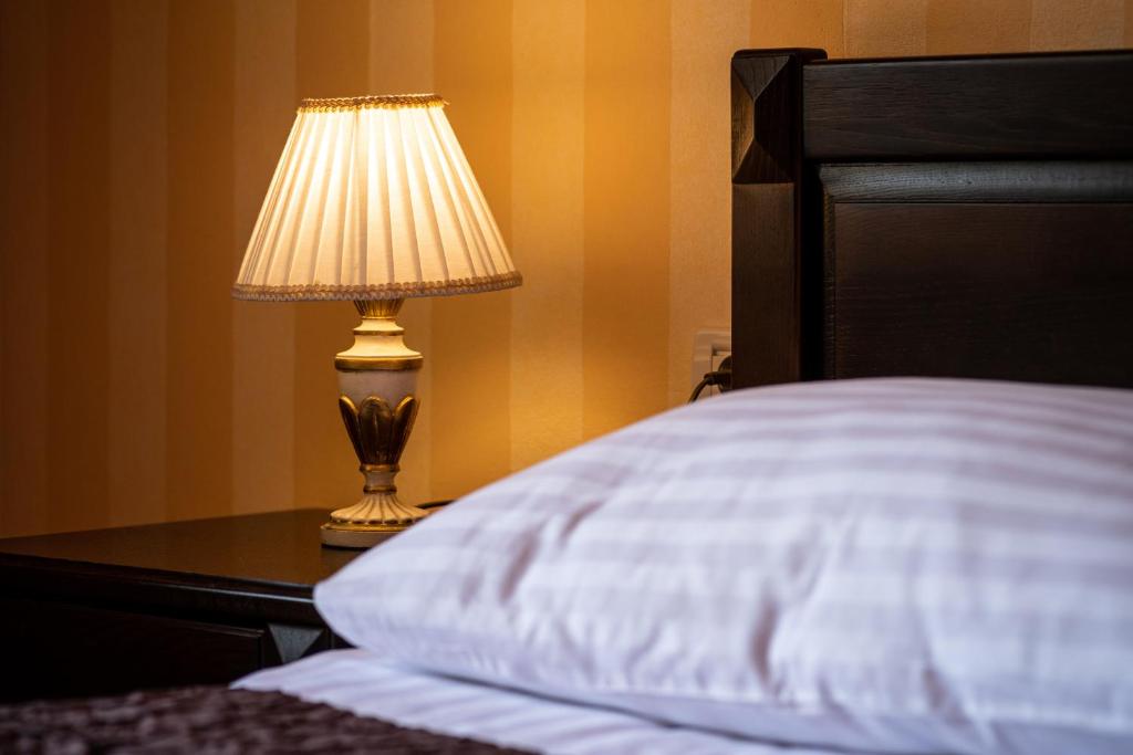 Postel nebo postele na pokoji v ubytování Boutique Hotel Villa Pattiera