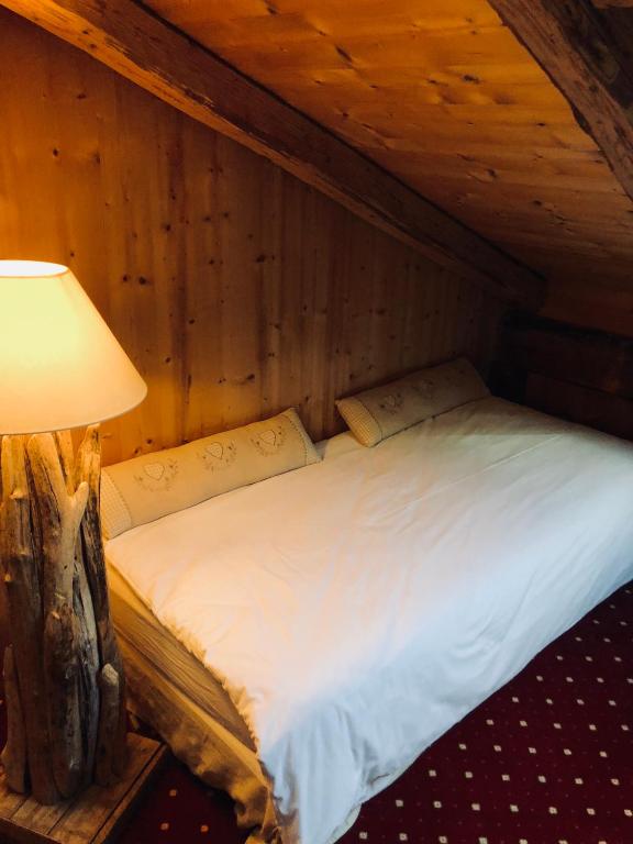 Postel nebo postele na pokoji v ubytování Le Coin Savoyard
