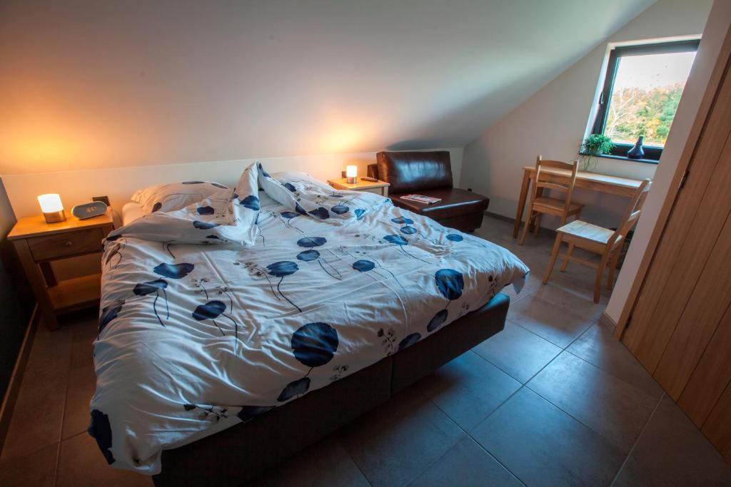 Postel nebo postele na pokoji v ubytování B&B D'Hollehoeve